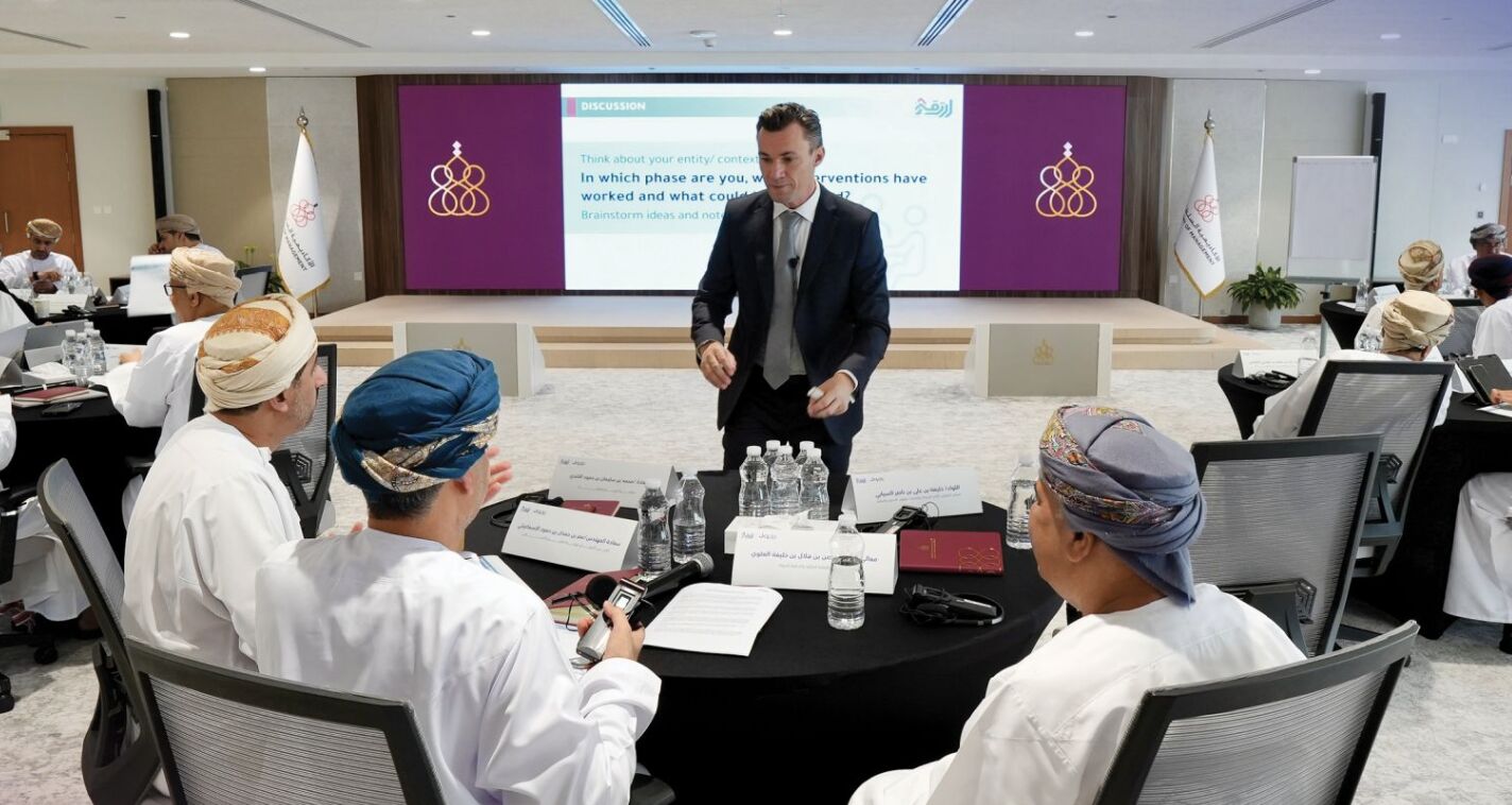 René Bohnsack leading a discussion with delegates around a round table at the Ertiqaa symposium